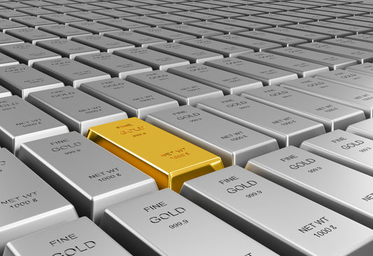 Single gold bar stands out among rows of silver bars - Mia Ishaaq