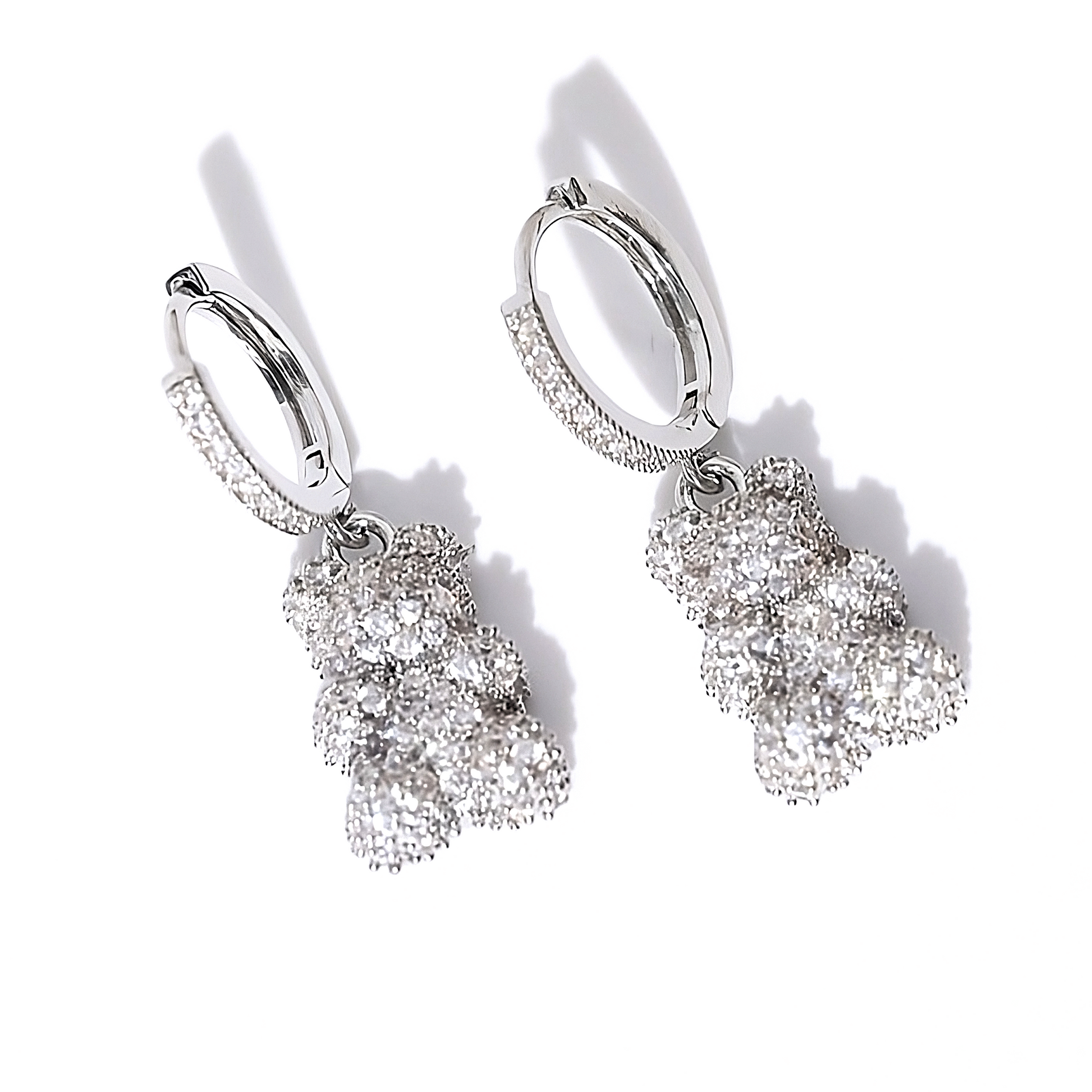 Sterling silver teddy bear dangle earrings featuring an all-over cubic zirconia design, displayed on a clean white background to highlight their sparkle and detail - Mia Ishaaq