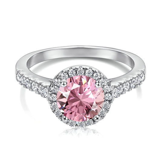 Close-up view of the pink cubic zirconia halo solitaire ring on a pure white background, showcasing the sparkling clear cubic zirconia stones surrounding the band - Mia Ishaaq