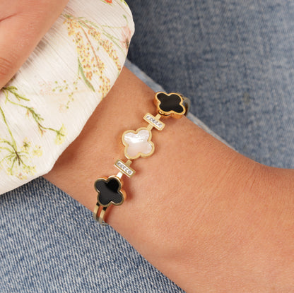 Image: Sparkling 18K gold four-leaf clover bracelet, designed for enduring elegance. Waterproof and stylish accessory for a timeless charm - Mia Ishaaq