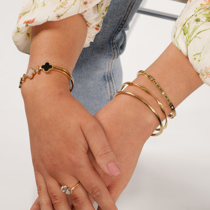 Image: Sparkling 18K gold four-leaf clover bracelet, designed for enduring elegance. Waterproof and stylish accessory for a timeless charm - Mia Ishaaq