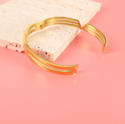 A gold V Line Harmony Bangle Bracelet by Mia Ishaaq, showcasing minimalist jewellery at its finest. 