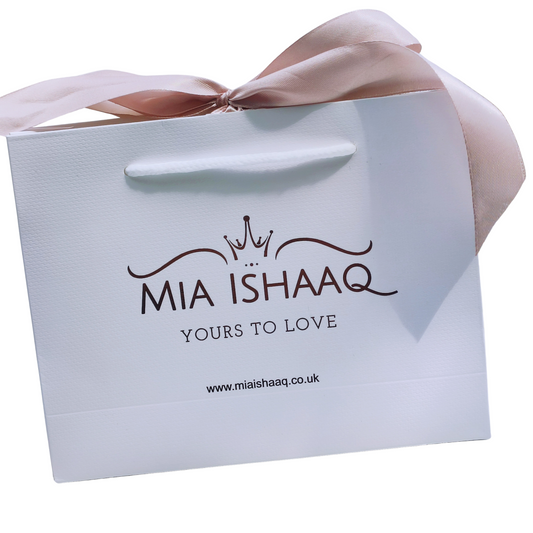 White Textured Gift bag with pink ribbon and rose gold logo - Mia Ishaaq