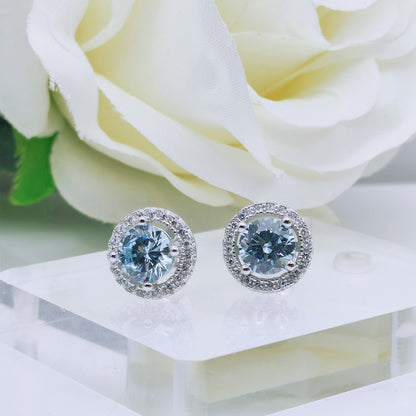 925 Sterling Silver White Gold Plated Aquamarine Blue Cubic Zirconia Round Stud Earrings - Mia Ishaaq