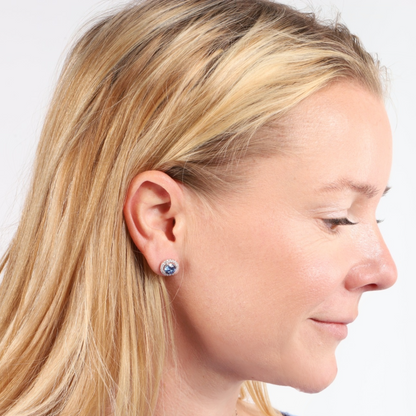 Profile of a person with long blonde hair, adorned with Blue Horizon Radiant Studs by Mia Ishaaq, against a white background.