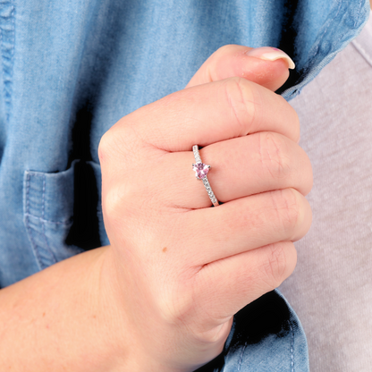 Close-up of a hand wearing the stunning Mia Ishaaq Sterling Silver Heart Solitaire Ring, with a denim shirt softly framing the background.