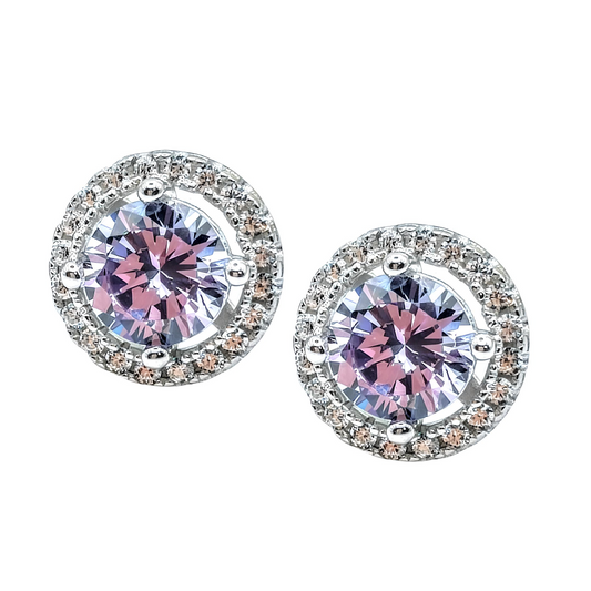 A pair of dazzling 925 Sterling Silver LAVENDER CZ Stud Earrings by Mia Ishaaq, showcasing round lavender cubic zirconia gemstones surrounded by a circle of smaller diamonds.