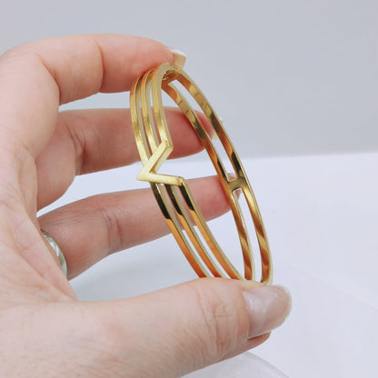18k PVD Gold Plated Stainless steel V line victory through harmony bangle bracelet - Mia Ishaaq