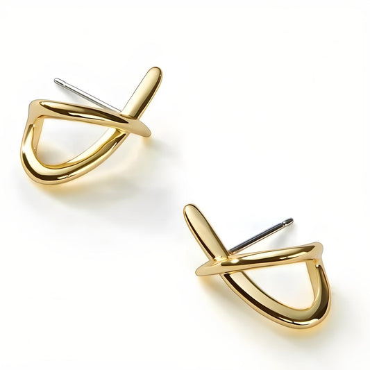 Pair of Gold Loop Cross Stud Earrings placed on their side on the plain white background - Mia Ishaaq