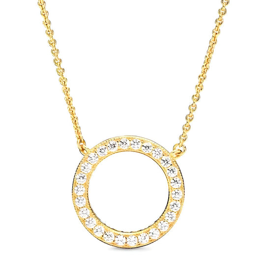 Introducing the Circle of Sparkle Pendant Necklace by Mia Ishaaq: a stunning gold-plated piece featuring a circular pendant encrusted with glistening cubic zirconia stones.