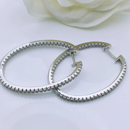 Sterling Silver Cubic Zirconia Oval Shape Hoop Earrings - Mia Ishaaq